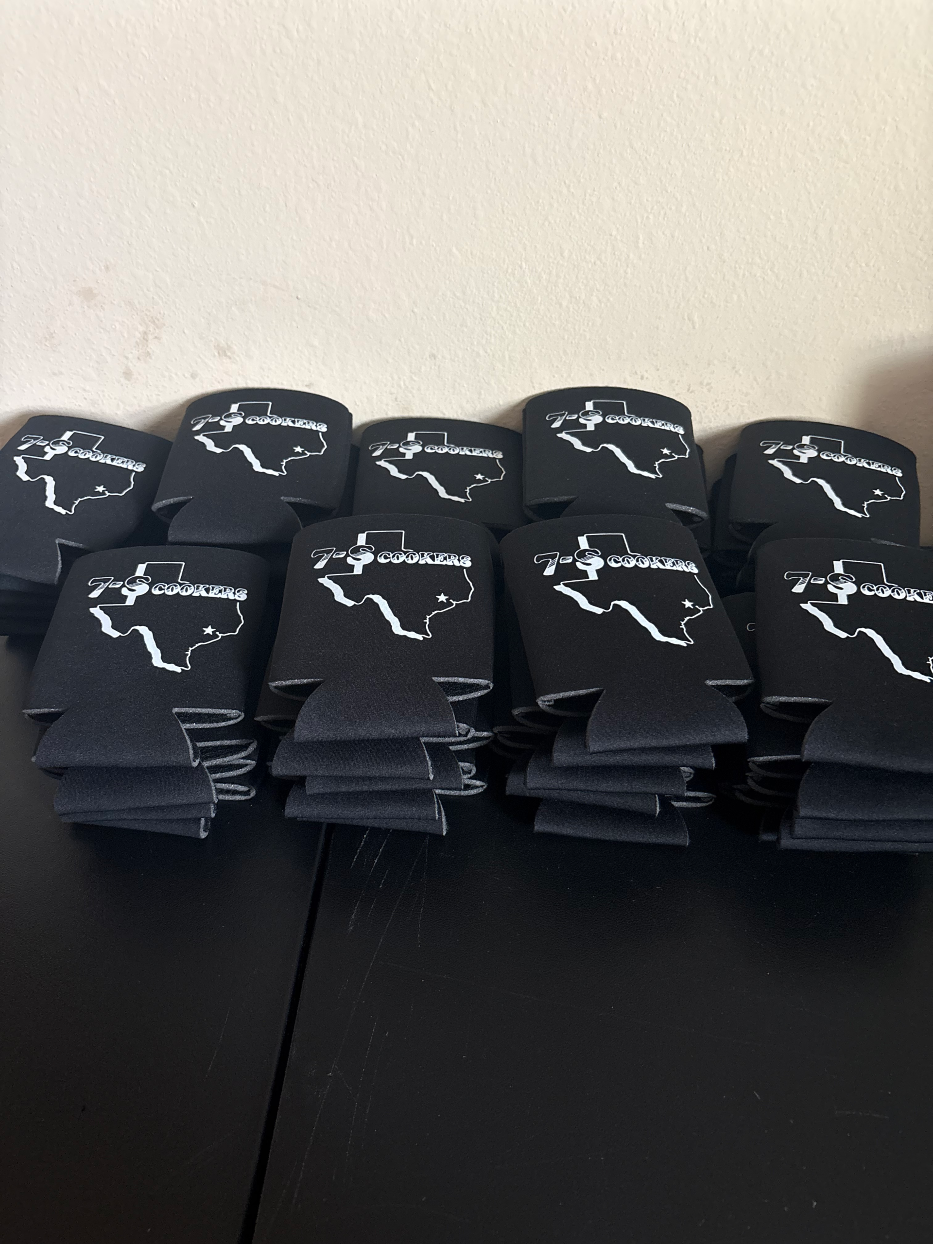 Portfolio Black branded can coolers with Texas-shaped printed graphics