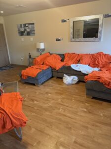 Home Orange and light-colored shirts laid out for an apparel order