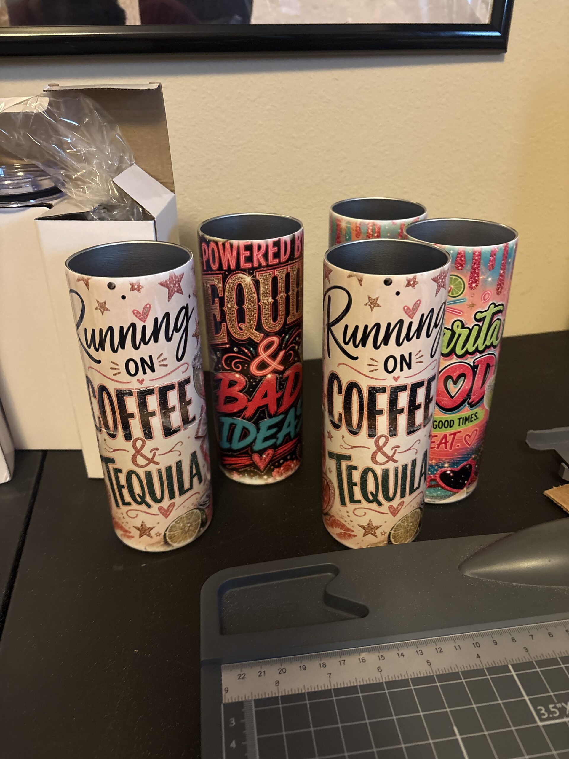Home Three personalized coffee tumblers with colorful printed designs